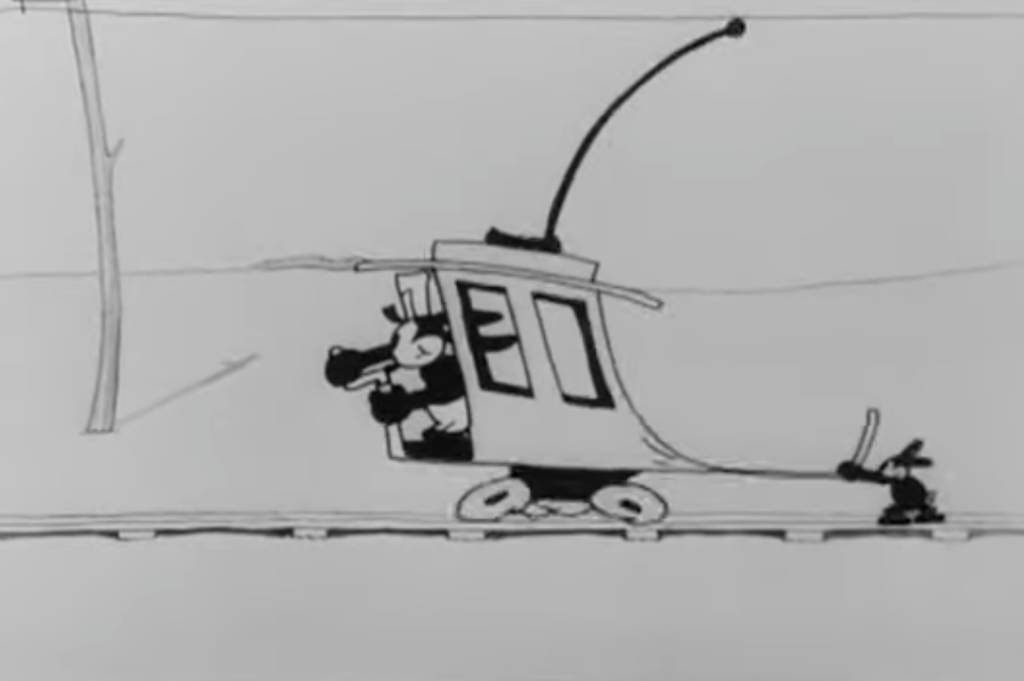 a black and white cartoon of Oswald the Lucky Rabbit driving a trolley while another rabbit holds it back
